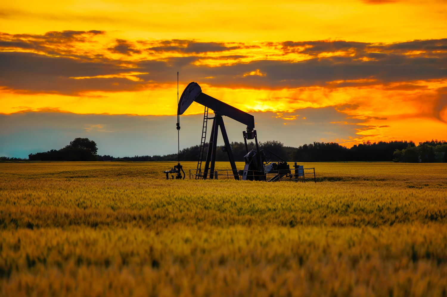 an abandoned oil well sits in a field, representing the need to seal orphaned wells to prevent methane leaks. 